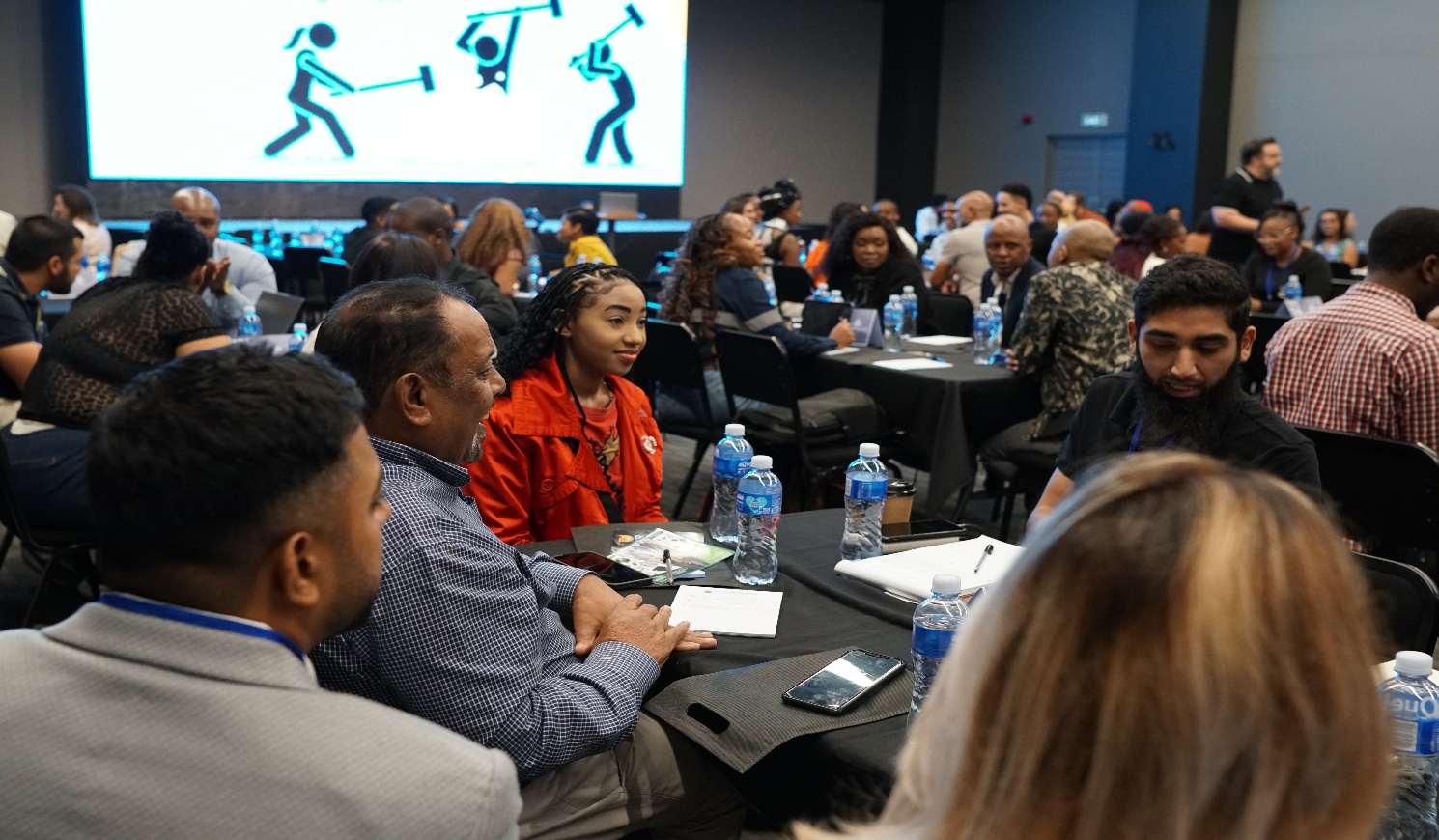 Entrepreneurs gathered around tables at the Durban Growth Summit