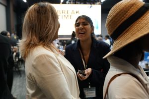 Attendees networking during a break at the summit
