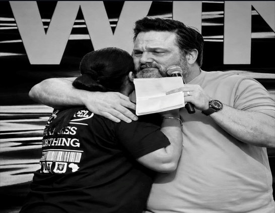 A finalist embraced on stage after the results were announced